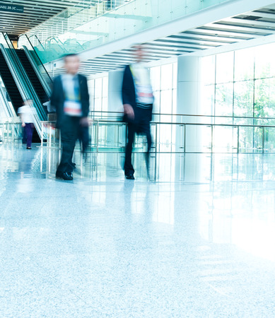 Business people rushing in the lobby. motion blurの写真素材