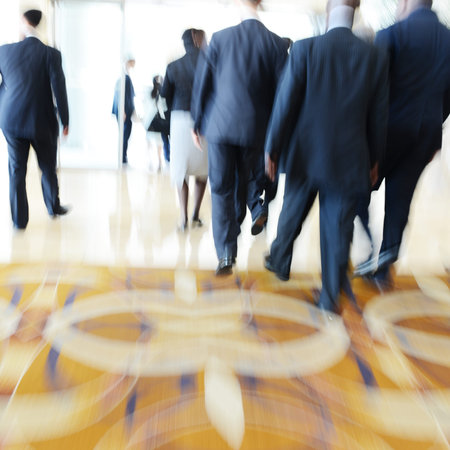 Business people rushing in the lobby. motion blurの写真素材