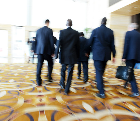 Business people rushing in the lobby. motion blurの写真素材