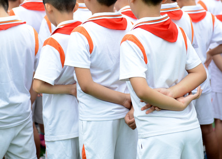 Row of young students standing together.の写真素材