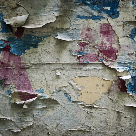 old torn posters on grunge wallの写真素材