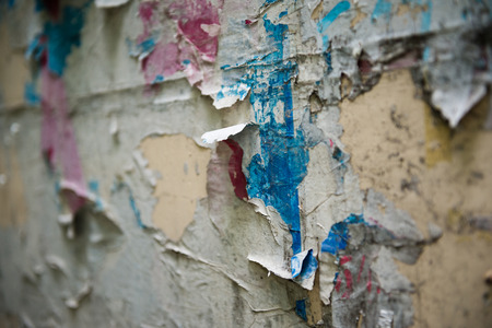 old torn posters on grunge wallの写真素材