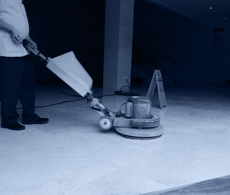 People cleaning floor with machine.の写真素材