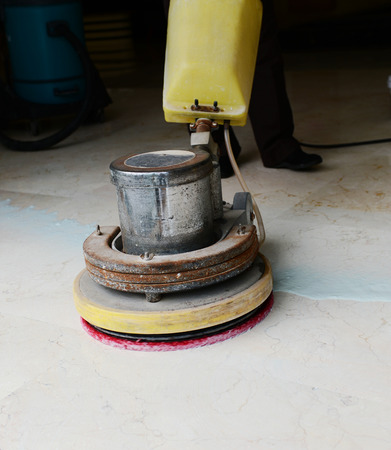 People cleaning floor with machine.の写真素材