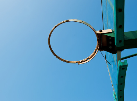 Basketball hoop against blue sky.の写真素材