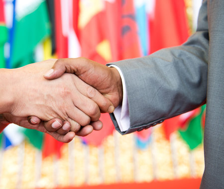 African businessman's hand shaking white businessman's hand  making a business deal.の写真素材
