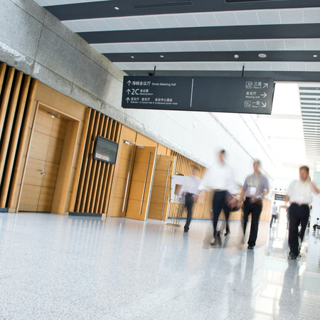 Business people rushing in the lobby. motion blurのeditorial素材