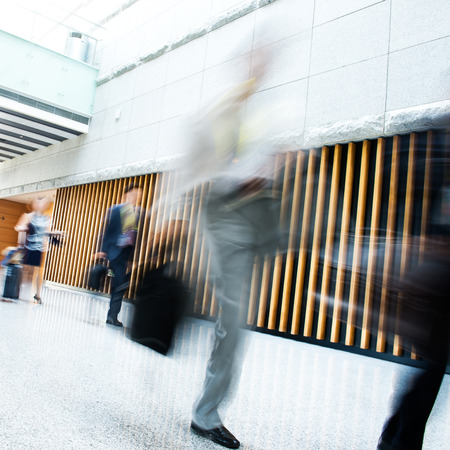 Business people rushing in the lobby. motion blurのeditorial素材