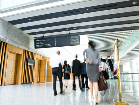 Business people rushing in the lobby. motion blurのeditorial素材