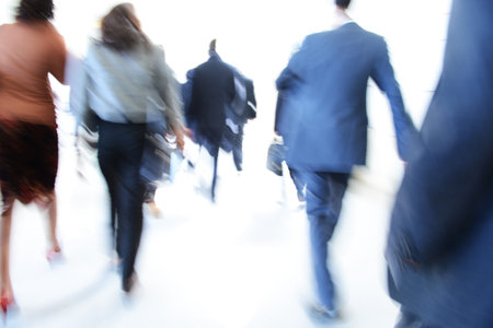 Business people rushing in the lobby. motion blurの写真素材