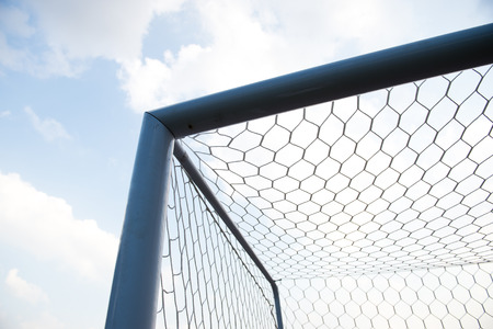 soccer goal against cloudy sky background.の写真素材