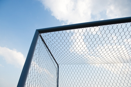 soccer goal against cloudy sky background.の写真素材