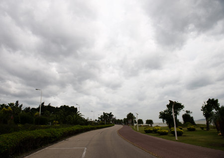 winding road with gloomy cloudscape.の写真素材