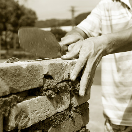 builder laying bricks in site.の写真素材