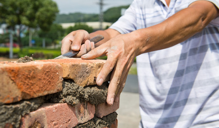 builder laying bricks in site.の写真素材