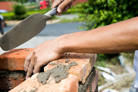 builder laying bricks in site.の写真素材