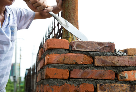 builder laying bricks in site.の写真素材