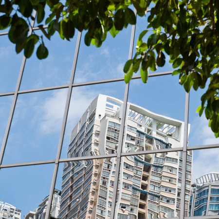 highrise reflected in windows of modern office building.のeditorial素材