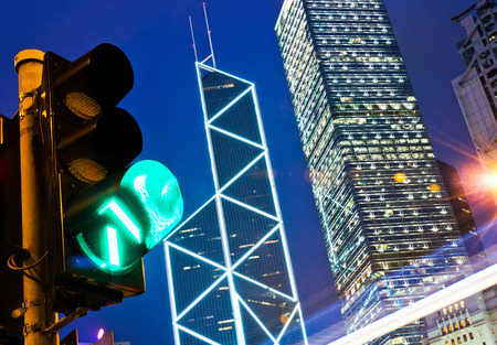 Traffic light in the modern city at night, hong kong.の写真素材