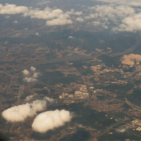 Blue sky with white clouds, view from a flying airplane.の写真素材