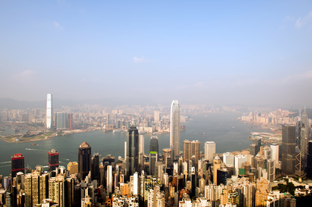 Hong Kong cityscape with victoria harbour and large group of tall buildings.の写真素材