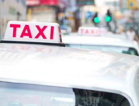 Taxi sign on the street, Hong Kong. selective focusの写真素材