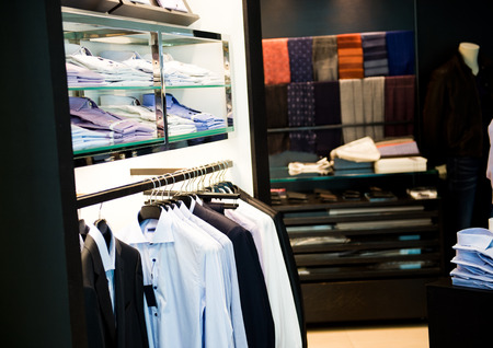 fashion clothing on hangers at the showの写真素材