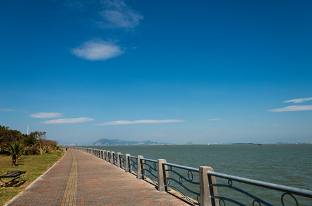 A curve walkway on seaside.の写真素材