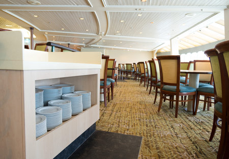 Group of white plates stacked together in a hotel.のeditorial素材