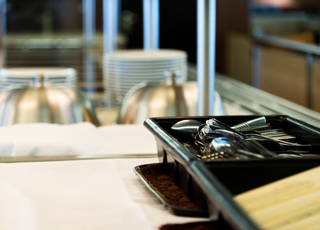 Group of white plates stacked together in a hotel.の写真素材