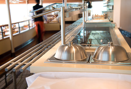 Group of white plates stacked together in a hotel.の写真素材