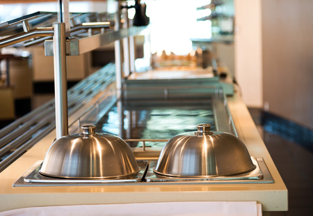 Group of white plates stacked together in a hotel.の写真素材