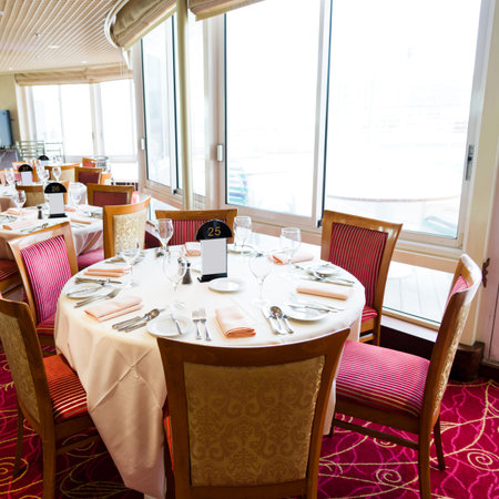 Empty tables at a luxury cruise restaurantのeditorial素材