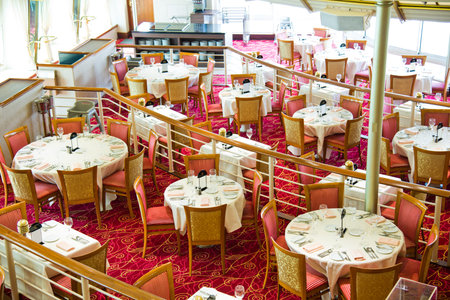 Empty tables at a luxury cruise restaurantのeditorial素材