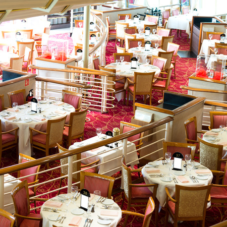 Empty tables at a luxury cruise restaurantのeditorial素材