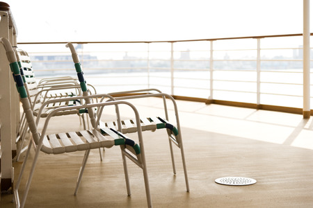 row of sun chairs  on the ship deckの写真素材