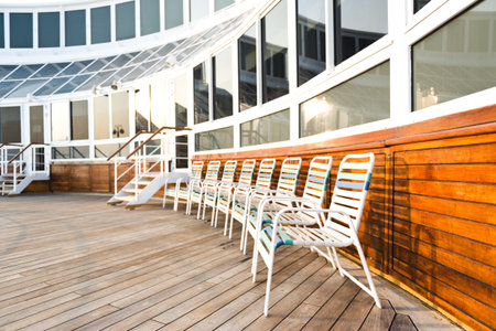 row of sun chairs  on the ship deck