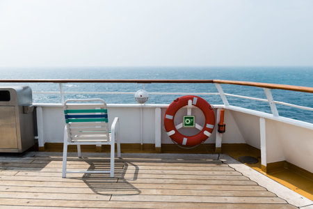 row of sun chairs  on the ship deck