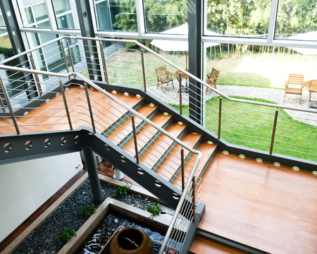 Empty office stairs with handrail in a modern building.のeditorial素材