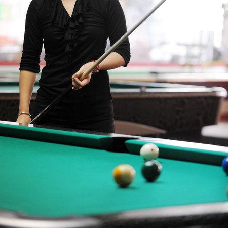 Close-up shot of a woman playing snooker