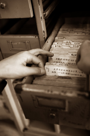 going through the files in a library.のeditorial素材