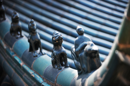 sculptures on the roof of ancient architecture in China.の写真素材