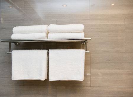 Clean white towel on a hanger prepared to use.の写真素材