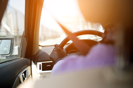 Girl in a car with the seatbelt always fasten.の写真素材