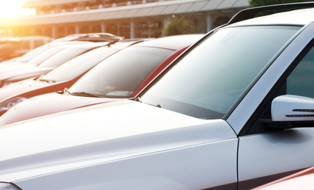 many cars parked in a rowの写真素材
