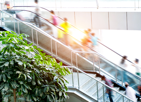 People rush on escalator motion blurred.のeditorial素材