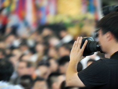 Live broadcasting, television operator with camera. Selective focus on handの写真素材