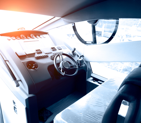 steering wheel on a luxury yacht cabin.の写真素材