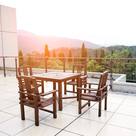 Apartment building roof top terrace exterior with table and chairs.の写真素材