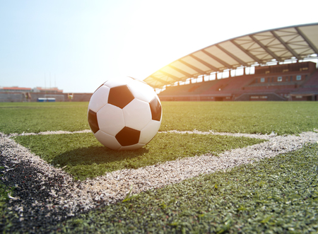 soccer ball on stadium grass line.のeditorial素材